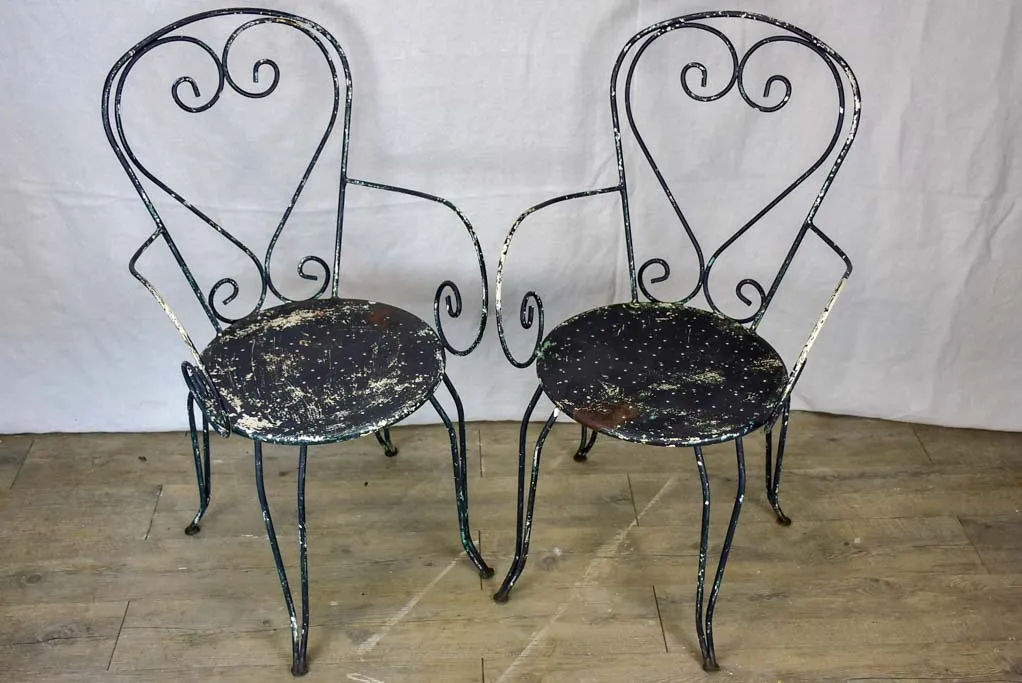 Pair of heart-back garden armchairs with black painted finish