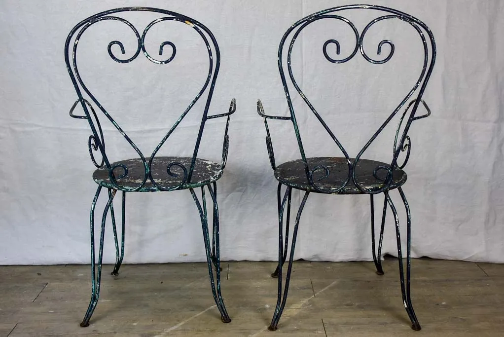 Pair of heart-back garden armchairs with black painted finish